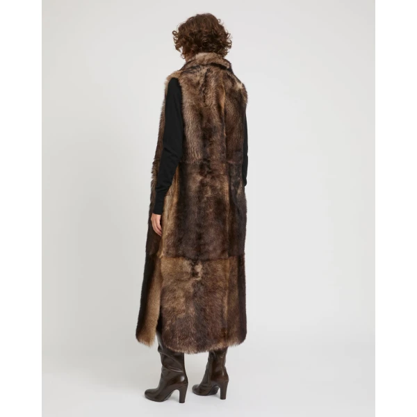Woman wearing Yves Salomon shearling fur coat – luxury outerwear at Coveti