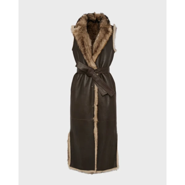 Woman wearing Yves Salomon shearling fur coat – luxury outerwear at Coveti