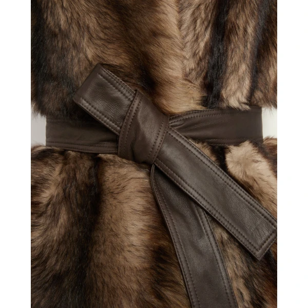 Woman wearing Yves Salomon shearling fur coat – luxury outerwear at Coveti