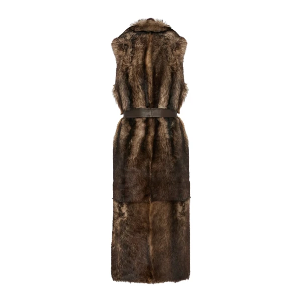 Woman wearing Yves Salomon shearling fur coat – luxury outerwear at Coveti