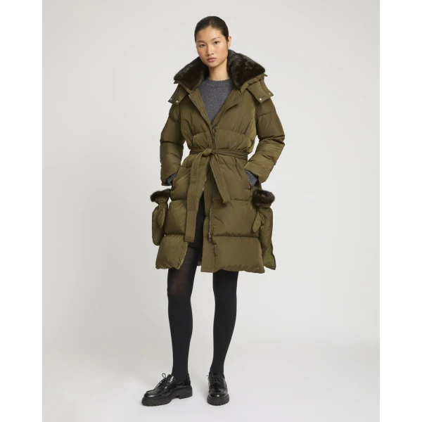 Woman wearing Yves Salomon shearling fur coat – luxury outerwear at Coveti