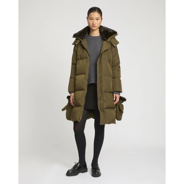 Woman wearing Yves Salomon shearling fur coat – luxury outerwear at Coveti