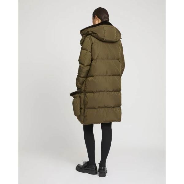 Woman wearing Yves Salomon shearling fur coat – luxury outerwear at Coveti
