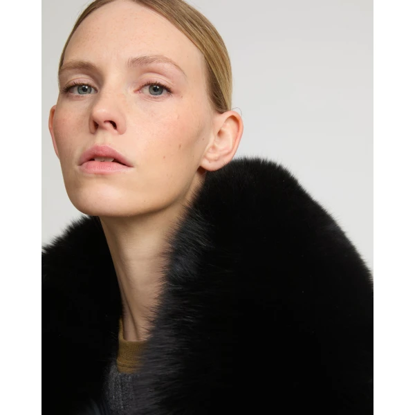 Woman wearing Yves Salomon shearling fur coat – luxury outerwear at Coveti