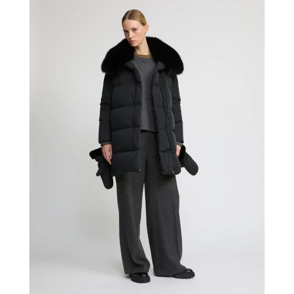 Woman wearing Yves Salomon shearling fur coat – luxury outerwear at Coveti