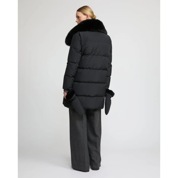 Woman wearing Yves Salomon shearling fur coat – luxury outerwear at Coveti