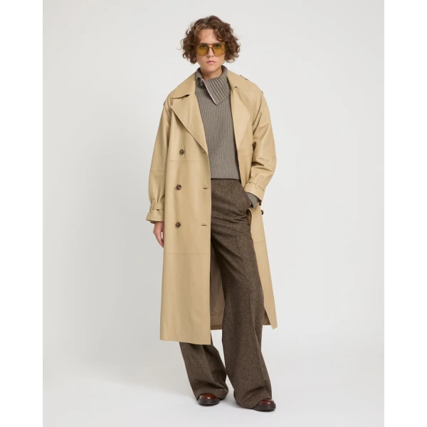 Woman wearing Yves Salomon shearling fur coat – luxury outerwear at Coveti