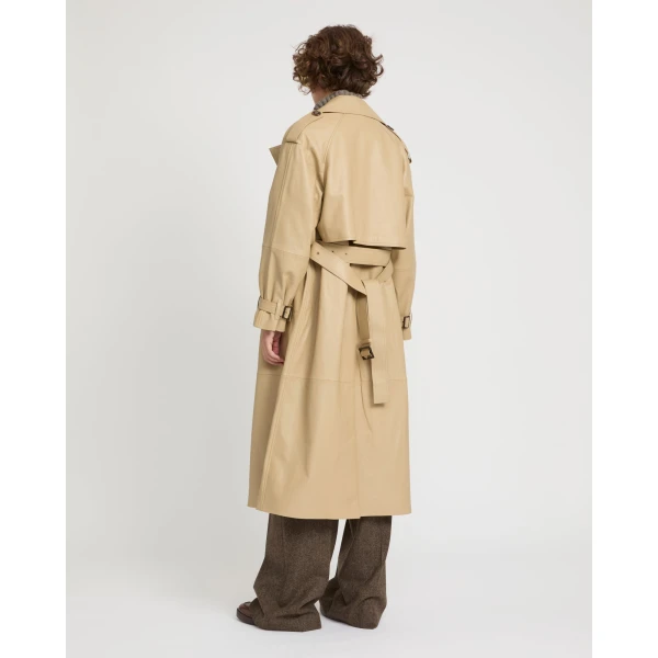 Woman wearing Yves Salomon shearling fur coat – luxury outerwear at Coveti