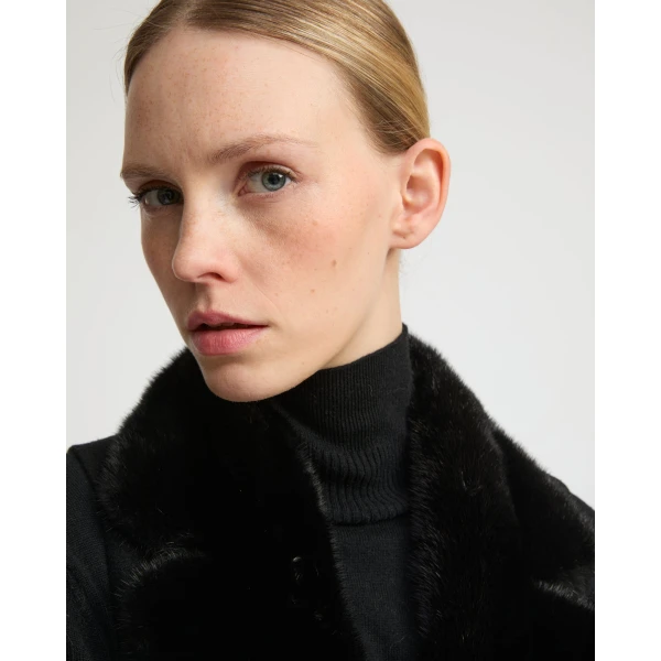 Woman wearing Yves Salomon shearling fur coat – luxury outerwear at Coveti