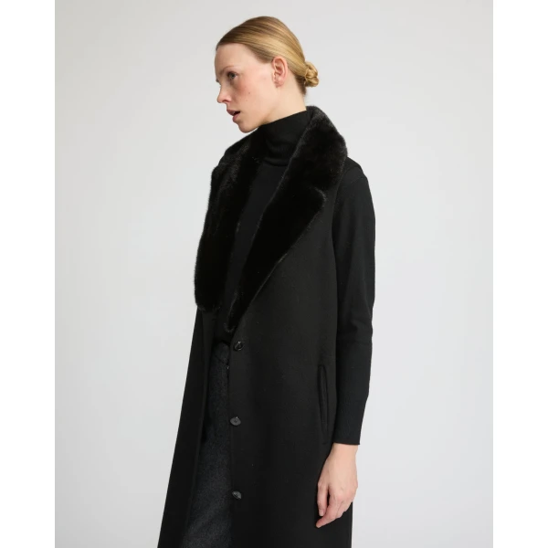 Woman wearing Yves Salomon shearling fur coat – luxury outerwear at Coveti