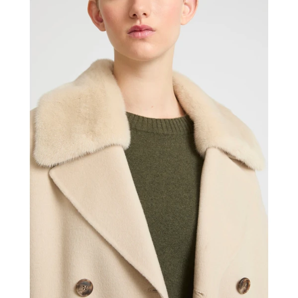 Woman wearing Yves Salomon shearling fur coat – luxury outerwear at Coveti
