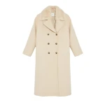 Woman wearing Yves Salomon shearling fur coat – luxury outerwear at Coveti
