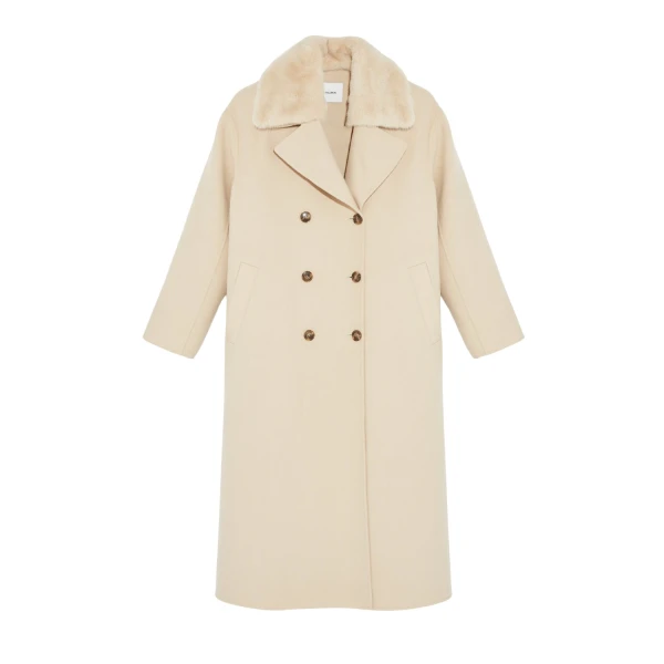Woman wearing Yves Salomon shearling fur coat – luxury outerwear at Coveti