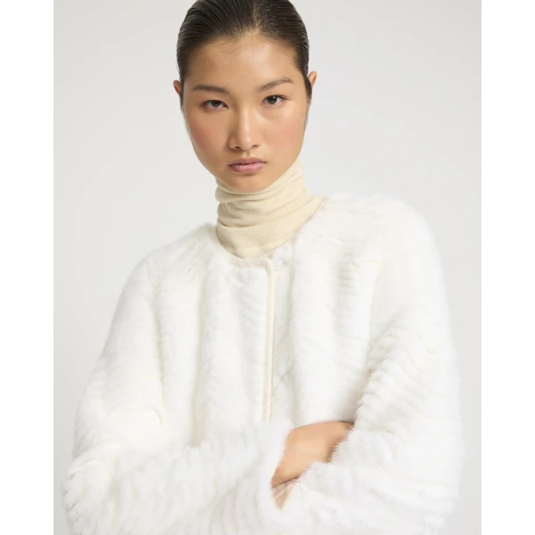 Woman wearing Yves Salomon shearling fur coat – luxury outerwear at Coveti