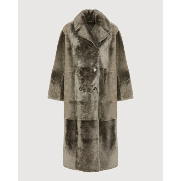 Woman wearing Yves Salomon shearling fur coat – luxury outerwear at Coveti