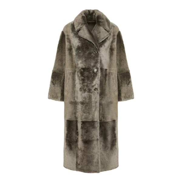 Woman wearing Yves Salomon shearling fur coat – luxury outerwear at Coveti