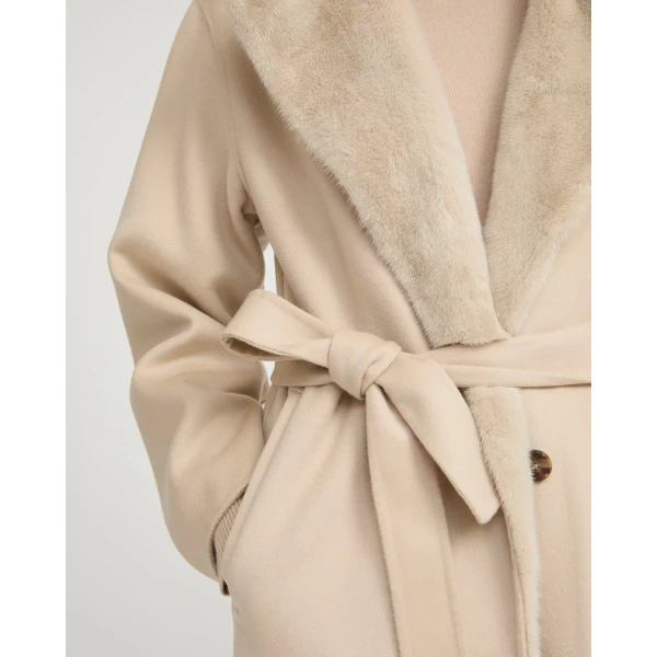 Woman wearing Yves Salomon shearling fur coat – luxury outerwear at Coveti