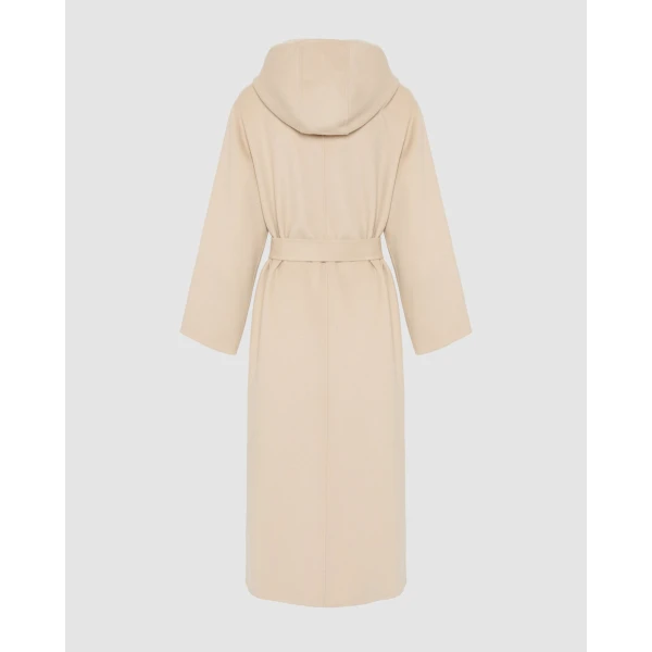 Woman wearing Yves Salomon shearling fur coat – luxury outerwear at Coveti