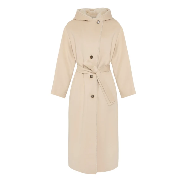Woman wearing Yves Salomon shearling fur coat – luxury outerwear at Coveti