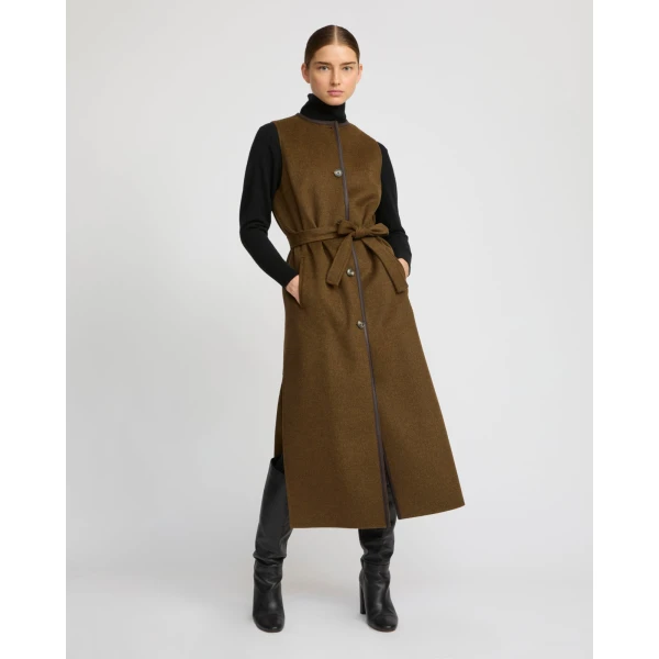 Woman wearing Yves Salomon shearling fur coat – luxury outerwear at Coveti