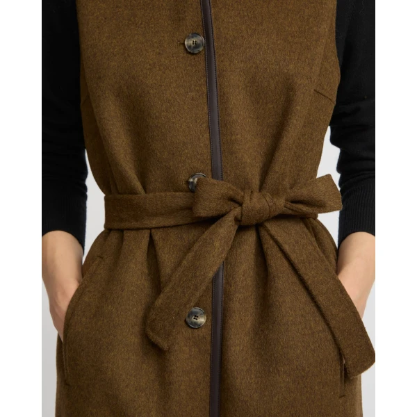 Woman wearing Yves Salomon shearling fur coat – luxury outerwear at Coveti