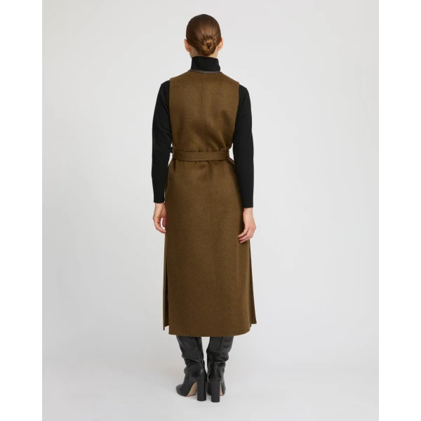 Woman wearing Yves Salomon shearling fur coat – luxury outerwear at Coveti