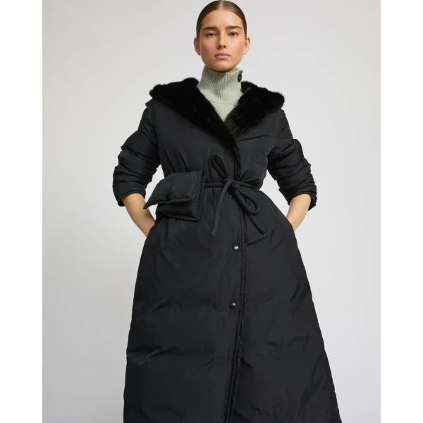 Woman wearing Yves Salomon shearling fur coat – luxury outerwear at Coveti