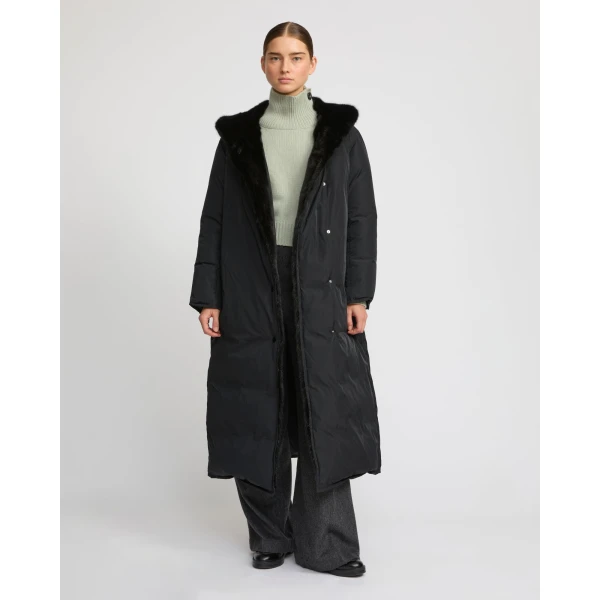 Woman wearing Yves Salomon shearling fur coat – luxury outerwear at Coveti