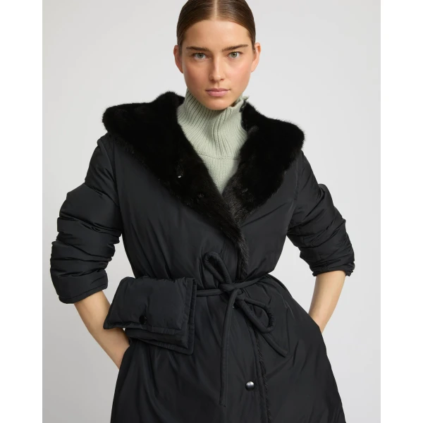 Woman wearing Yves Salomon shearling fur coat – luxury outerwear at Coveti