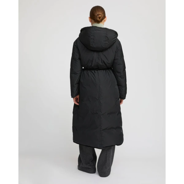 Woman wearing Yves Salomon shearling fur coat – luxury outerwear at Coveti