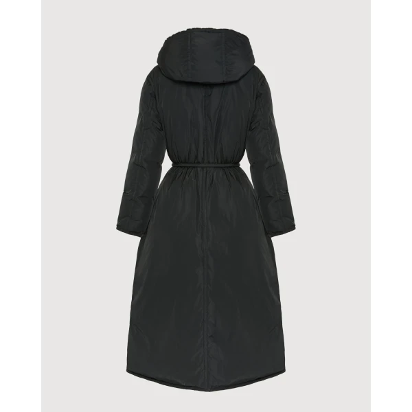 Woman wearing Yves Salomon shearling fur coat – luxury outerwear at Coveti