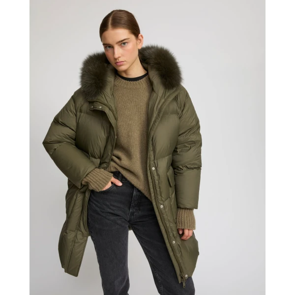 Woman wearing Yves Salomon shearling fur coat – luxury outerwear at Coveti