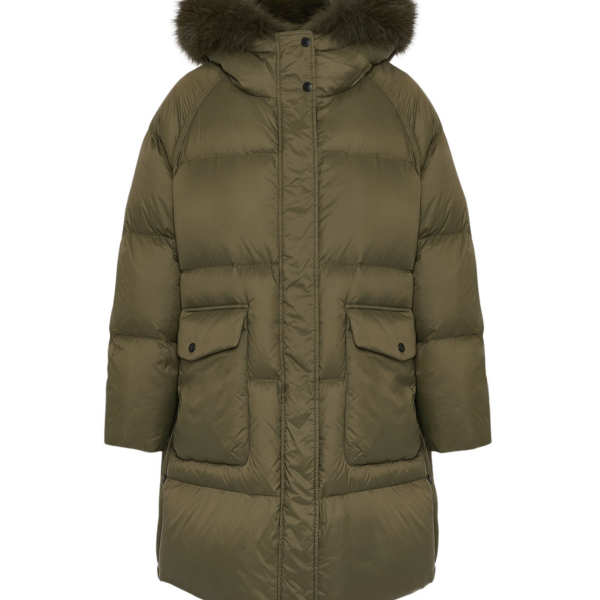 Woman wearing Yves Salomon shearling fur coat – luxury outerwear at Coveti