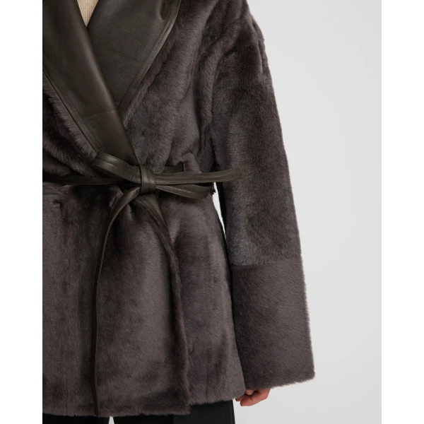 Woman wearing Yves Salomon shearling fur coat – luxury outerwear at Coveti