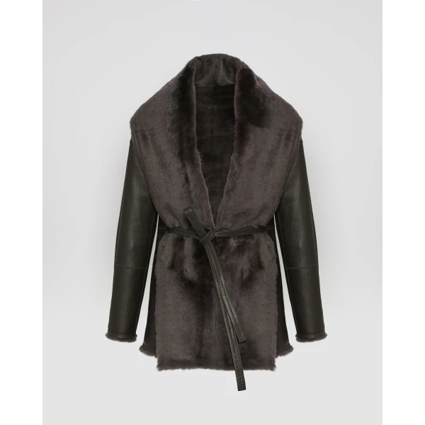 Woman wearing Yves Salomon shearling fur coat – luxury outerwear at Coveti