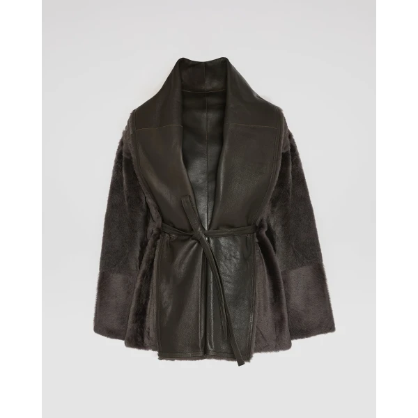 Woman wearing Yves Salomon shearling fur coat – luxury outerwear at Coveti