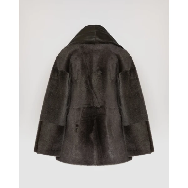 Woman wearing Yves Salomon shearling fur coat – luxury outerwear at Coveti