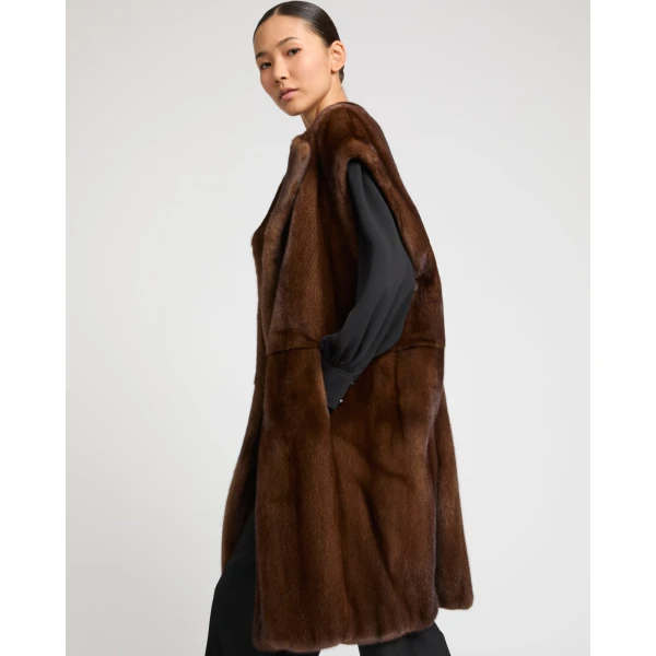 Woman wearing Yves Salomon shearling fur coat – luxury outerwear at Coveti