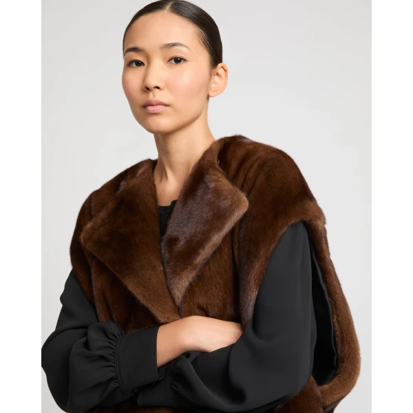 Woman wearing Yves Salomon shearling fur coat – luxury outerwear at Coveti