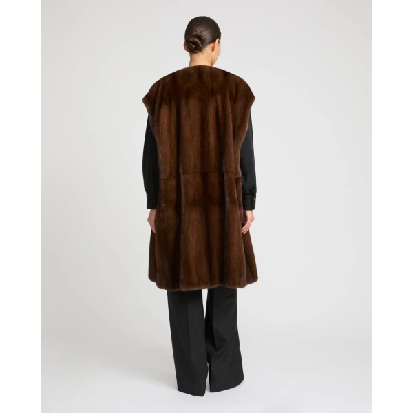 Woman wearing Yves Salomon shearling fur coat – luxury outerwear at Coveti