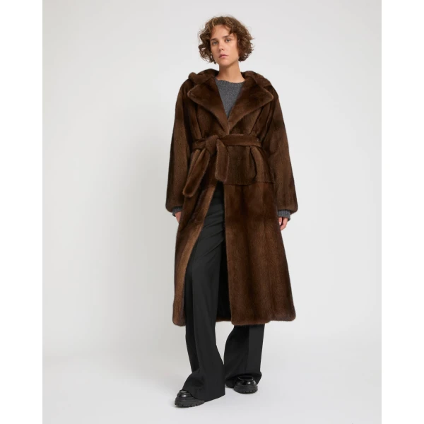 Woman wearing Yves Salomon shearling fur coat – luxury outerwear at Coveti