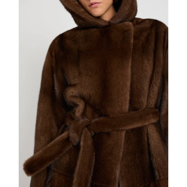 Woman wearing Yves Salomon shearling fur coat – luxury outerwear at Coveti
