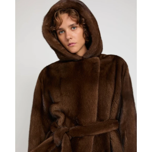 Woman wearing Yves Salomon shearling fur coat – luxury outerwear at Coveti