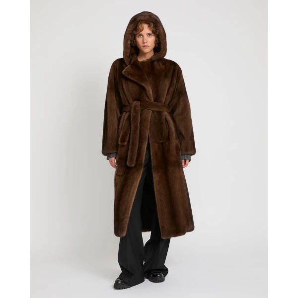 Woman wearing Yves Salomon shearling fur coat – luxury outerwear at Coveti