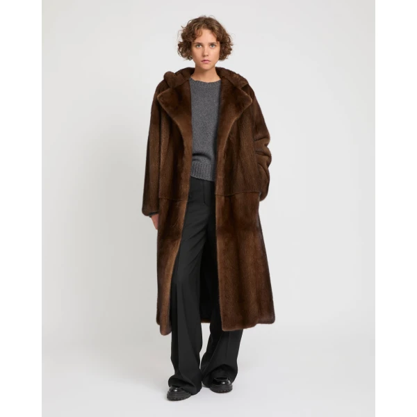 Woman wearing Yves Salomon shearling fur coat – luxury outerwear at Coveti
