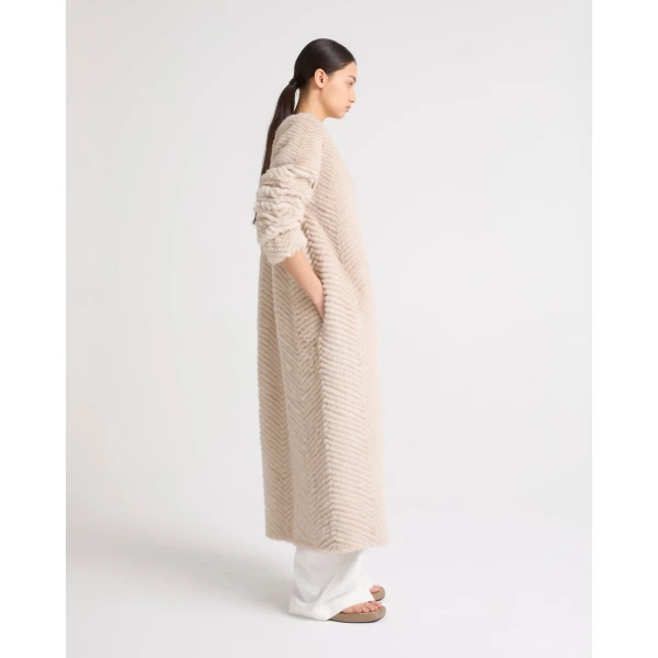 Woman wearing Yves Salomon shearling fur coat – luxury outerwear at Coveti