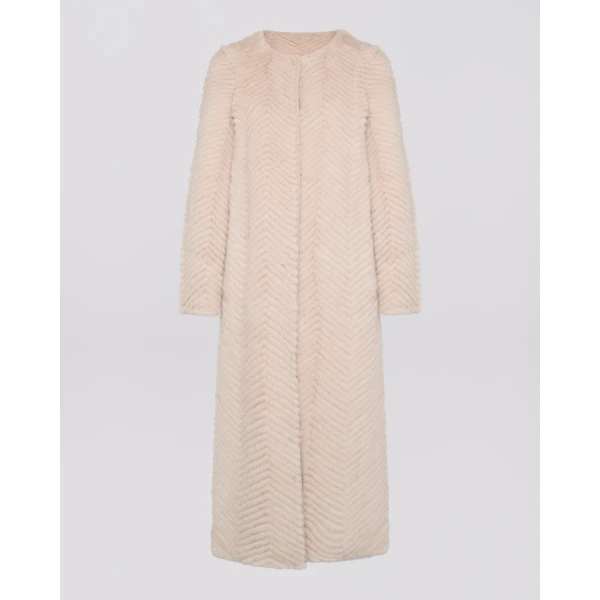 Woman wearing Yves Salomon shearling fur coat – luxury outerwear at Coveti