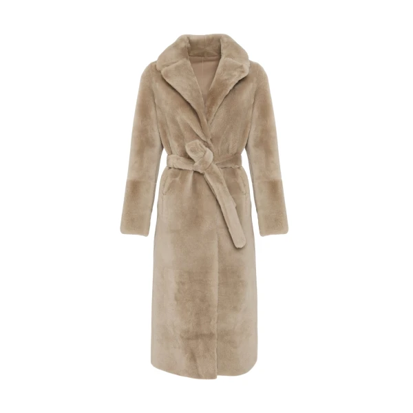 Woman wearing Yves Salomon shearling fur coat – luxury outerwear at Coveti