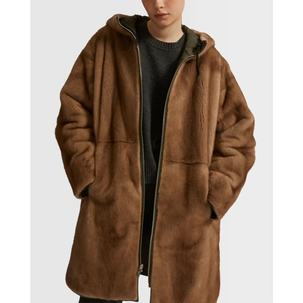 Woman wearing Yves Salomon shearling fur coat – luxury outerwear at Coveti