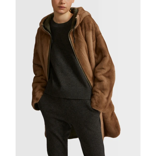 Woman wearing Yves Salomon shearling fur coat – luxury outerwear at Coveti